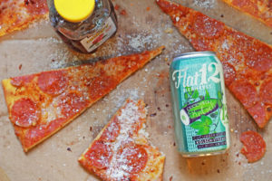 Enjoy Flat12 summer cucumber beer with pizza.